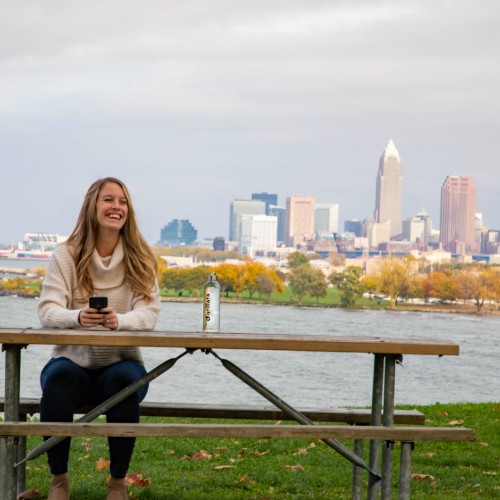 woman sitting on picnic table at edgewater park in cleveland, oh