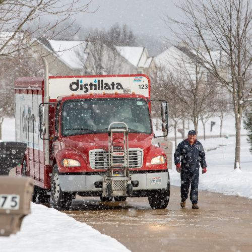 Distillata truck and driver in winter