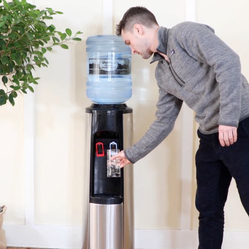 man getting glass of water from cooler (1)