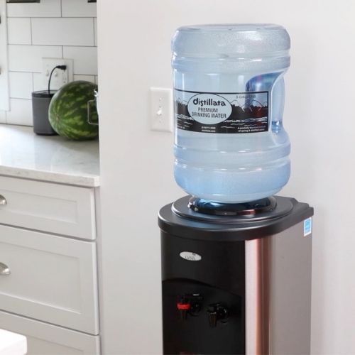 Stainless steel water cooler in kitchen at home