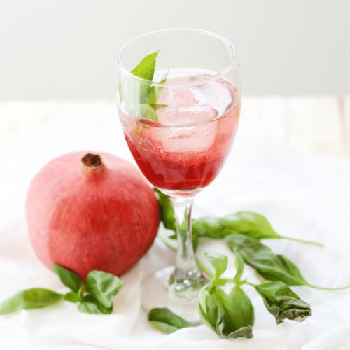 pomegranate cranberry spritzer in wine glass