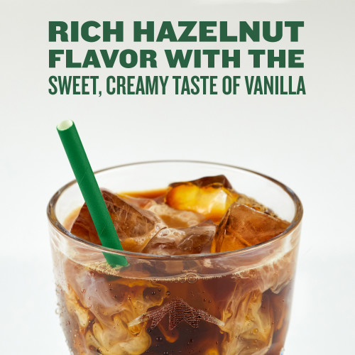 green mountain hazelnut vanilla iced coffee in a clear glass with green straw