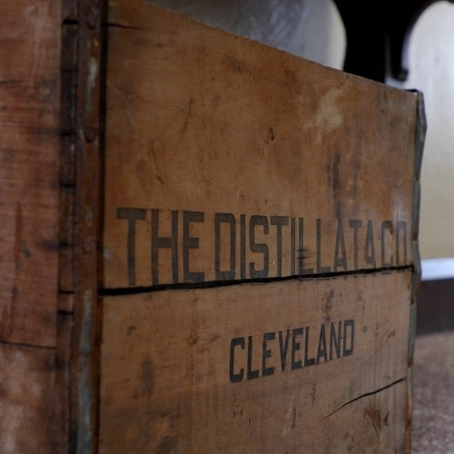 close up of the logo on a Distillata vintage wooden