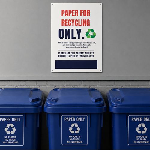 Three blue paper-only recycling bins beneath a paper recycling sign.